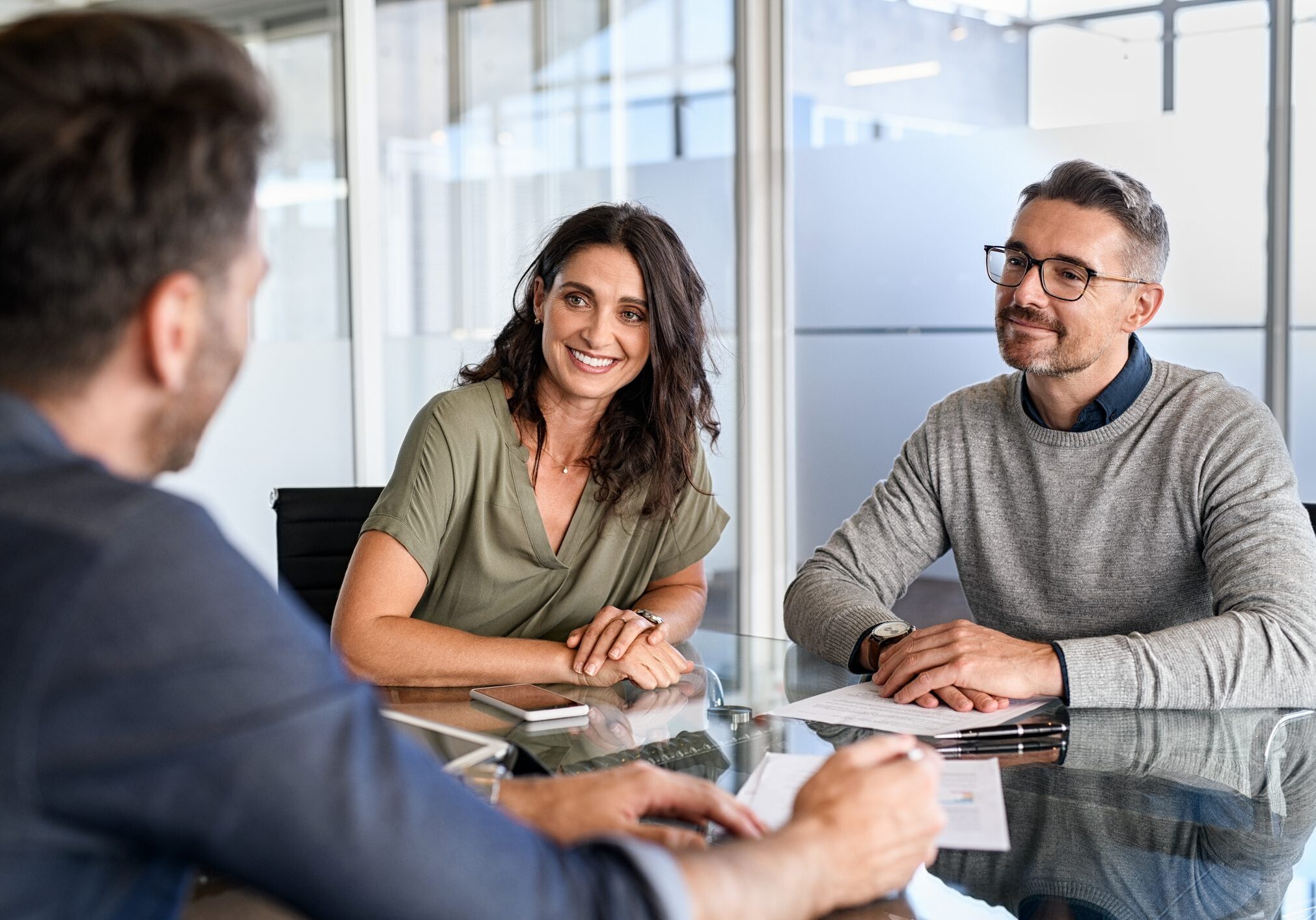 Three people having a business meeting.