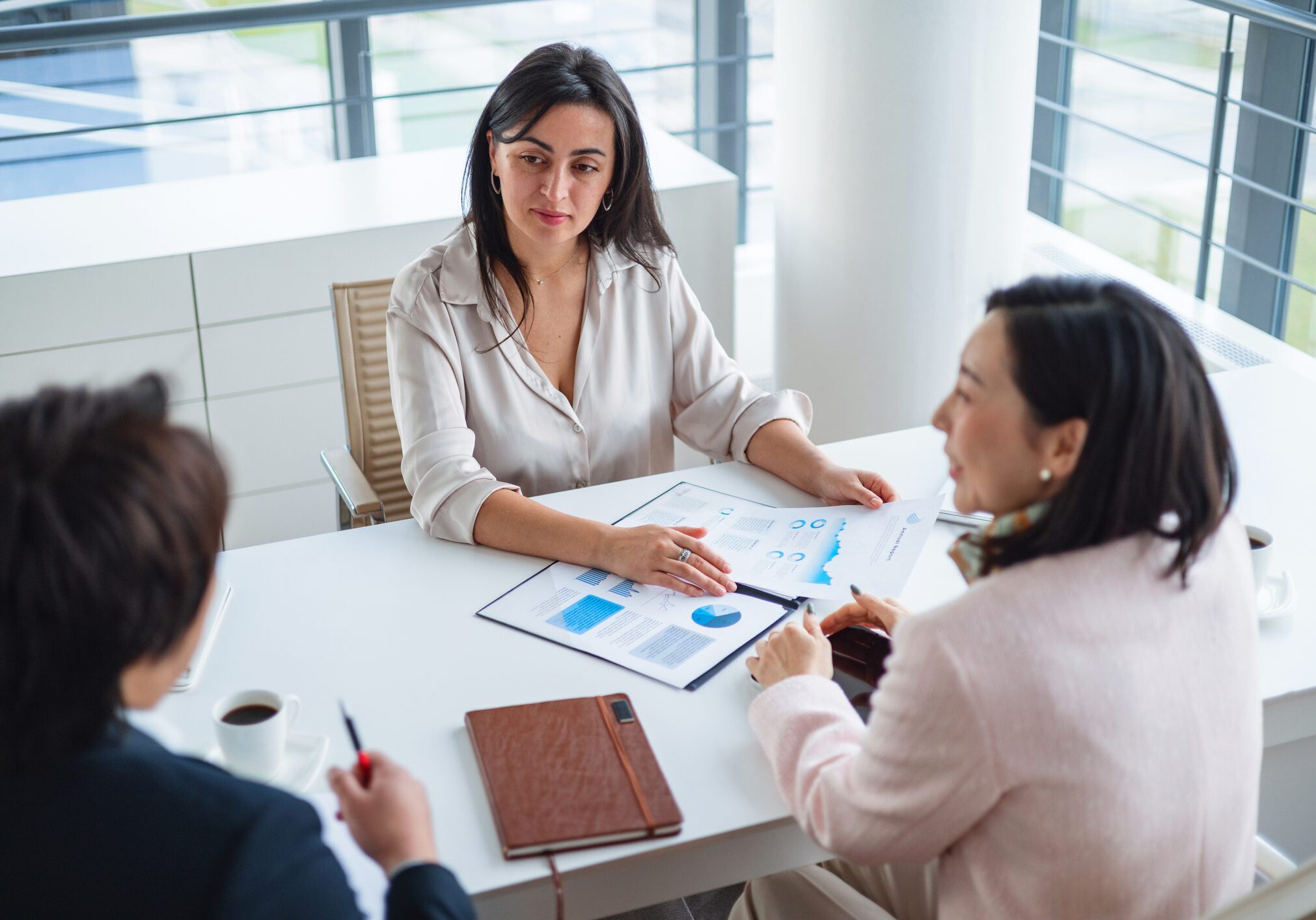 Three women having a business meeting.